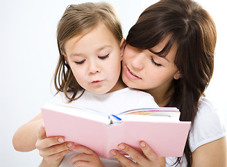 Image showing Mother is reading book with her daughter