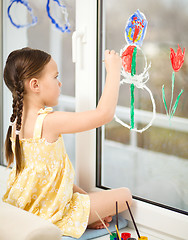 Image showing Portrait of a cute girl playing with paints