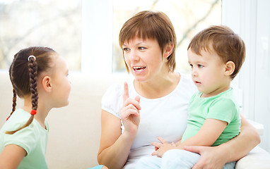 Image showing Mother talking to her children