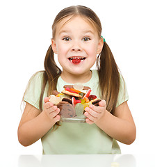 Image showing Happy girl with candies