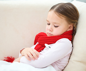 Image showing Ill little girl with thermometer in her mouth