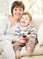 Image showing Mother and her son are watching tv