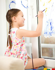 Image showing Portrait of a cute girl playing with paints