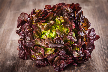 Image showing Assorted lettuce on wooden table