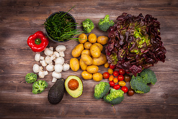 Image showing Assorted raw vegetables on wooden background