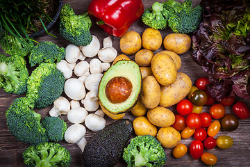 Image showing Assorted raw vegetables on wooden background