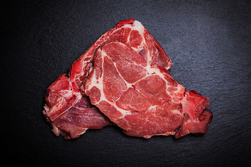 Image showing Fresh raw meat on black board