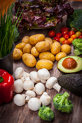 Image showing Assorted raw vegetables on wooden background
