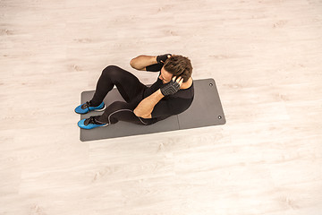 Image showing Man Doing Sit-ups