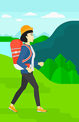 Image showing Woman with backpack hiking.