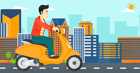 Image showing Man riding scooter.