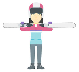 Image showing Woman holding skis.