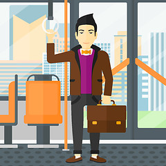 Image showing Man standing inside public transport.