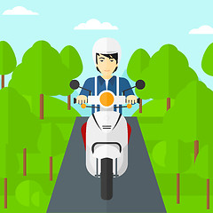 Image showing Man riding scooter.