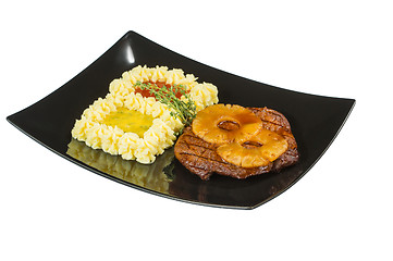 Image showing Pork tenderloin with grilled pineapple. Macro. Isolated white background