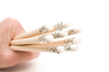 Image showing Hand holding wooden pencils with erasers