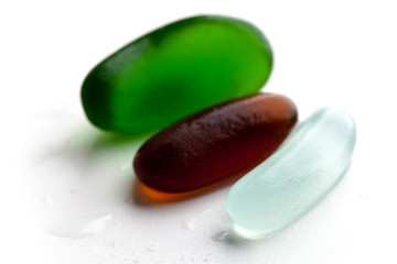 Image showing three wet glass pieces polished by the sea