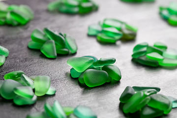 Image showing green pieces of glass polished by the sea