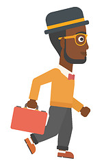 Image showing Businessman walking with briefcase.