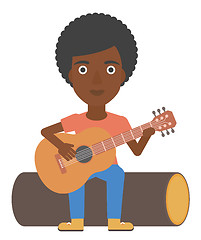 Image showing Woman playing guitar.