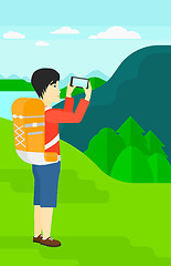 Image showing Backpacker taking photo.