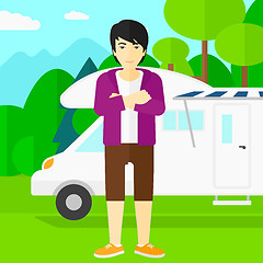 Image showing Man standing in front of motor home.