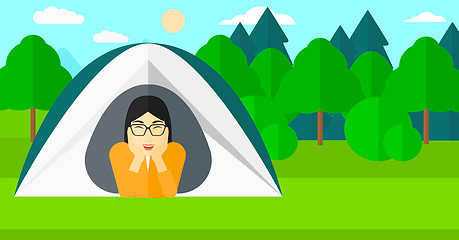 Image showing Woman lying in tent.