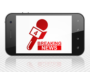 Image showing News concept: Smartphone with Breaking News And Microphone on display