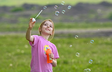 Image showing little girl play with soap bubbles