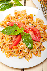 Image showing Italian pasta farfalle butterfly bow-tie and tomato sauce