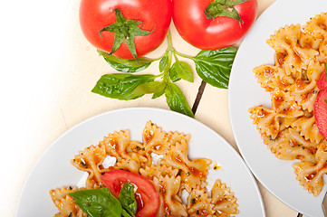 Image showing Italian pasta farfalle butterfly bow-tie and tomato sauce