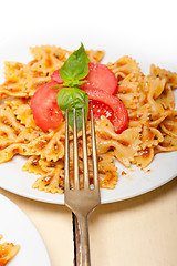 Image showing Italian pasta farfalle butterfly bow-tie and tomato sauce