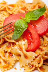 Image showing Italian pasta farfalle butterfly bow-tie and tomato sauce