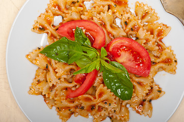 Image showing Italian pasta farfalle butterfly bow-tie and tomato sauce