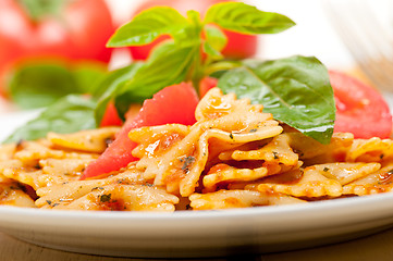 Image showing Italian pasta farfalle butterfly bow-tie and tomato sauce