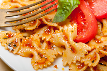 Image showing Italian pasta farfalle butterfly bow-tie and tomato sauce