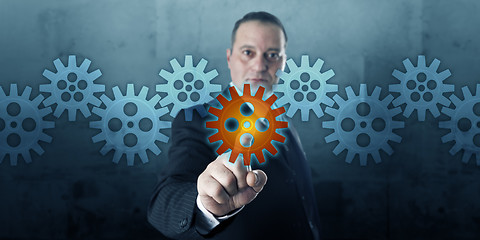 Image showing Entrepreneur Selecting A Cog In A Gear Train
