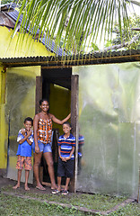 Image showing editorial lady and boys zinc sheet metal house Big Corn Island N