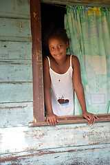 Image showing native Nicaraguan girl smiling  clapboard house Big Corn Island 