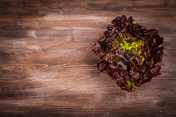 Image showing Assorted lettuce on wooden table