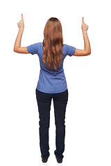 Image showing Back view of young female standing in full length