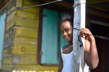 Image showing native Nicaraguan girl smiling  clapboard house Big Corn Island 