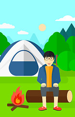 Image showing Man sitting at camp.