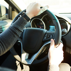 Image showing Close-up Of A Man Hands Holding Steering Wheel While Driving Car