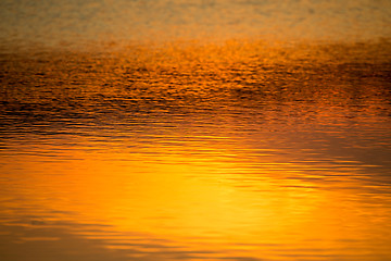 Image showing spring sunset reflecting in water