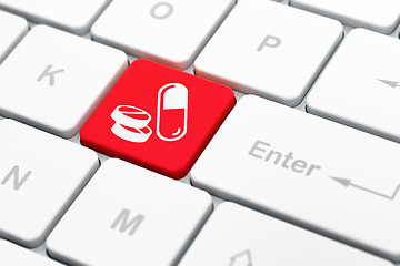 Image showing Healthcare concept: Pills on computer keyboard background