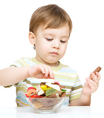 Image showing Portrait of a boy with candies