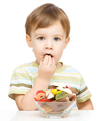 Image showing Portrait of a boy with candies