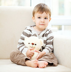 Image showing Portrait of a little boy with his teddy bear