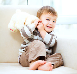 Image showing Portrait of a little boy with his teddy bear